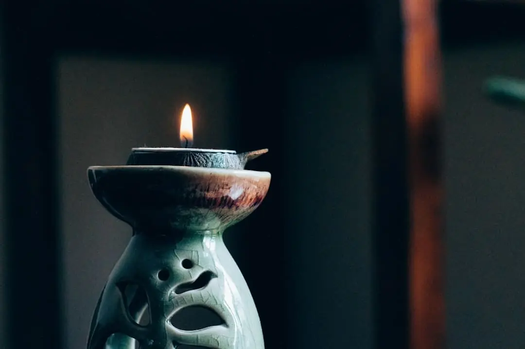 A propped up candle in a serene environment